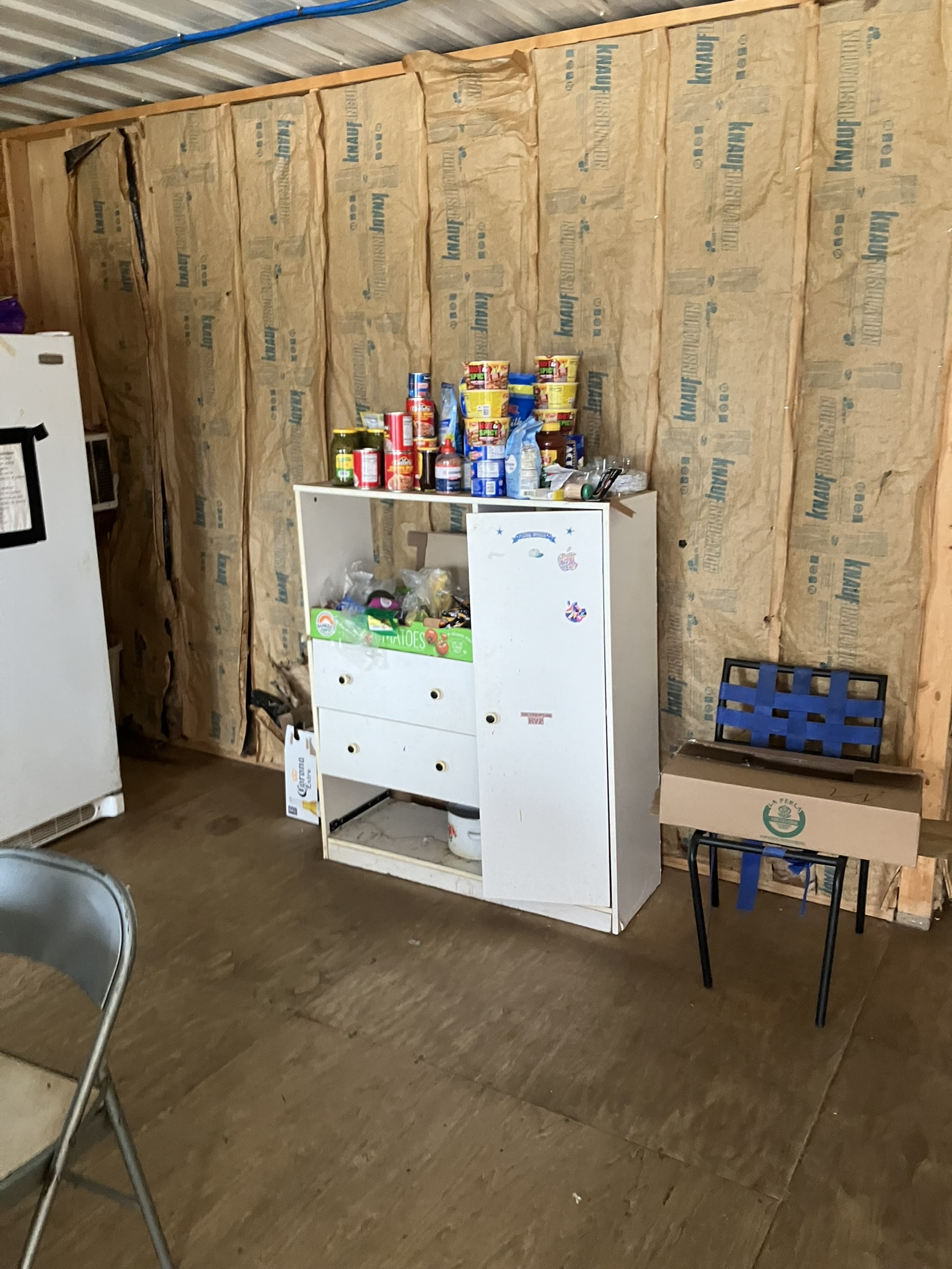 photo of kitchen with exposed insulation