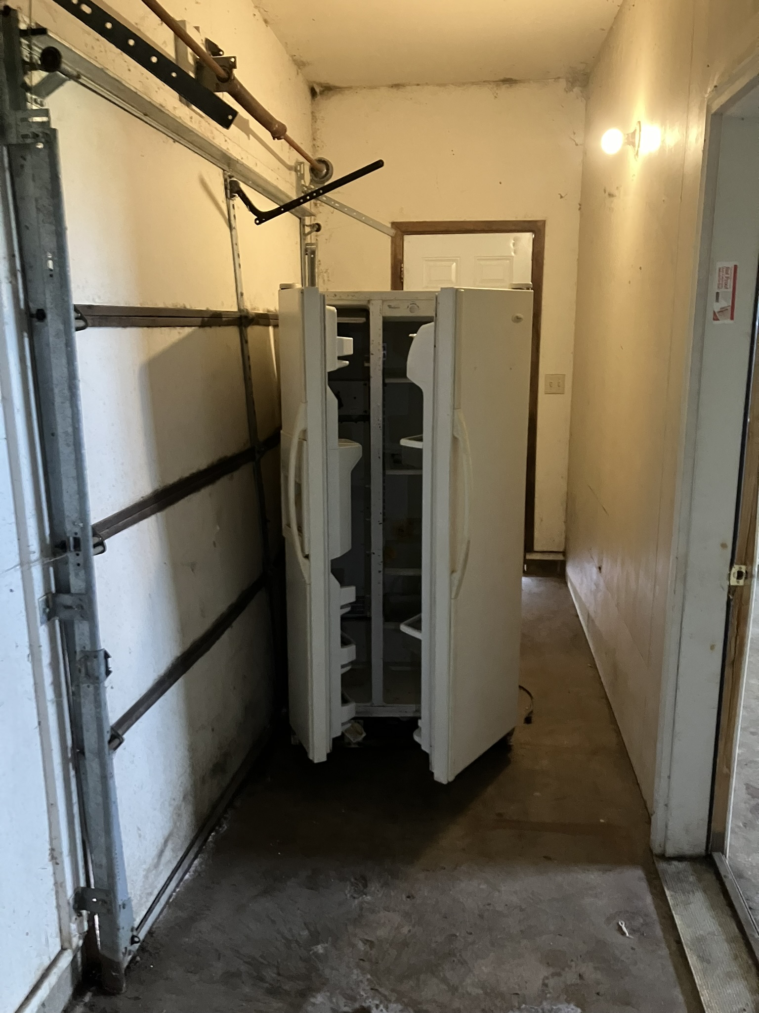 photo of a broken fridge