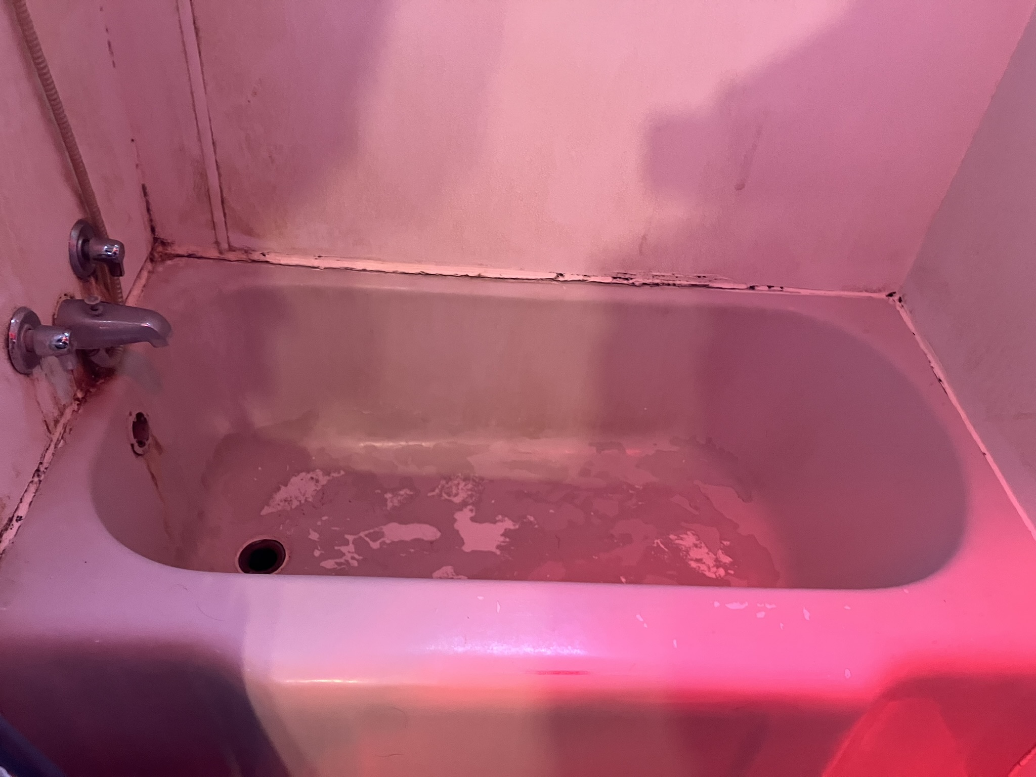 photo of a dirty bathtub