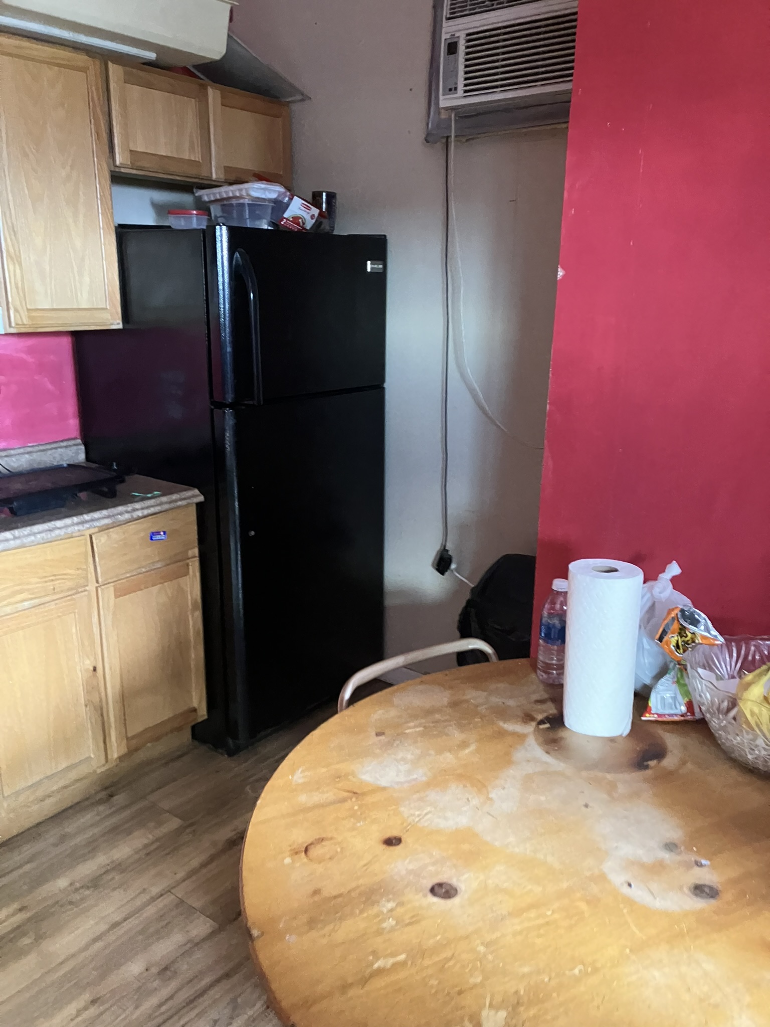 photo of a kitchen, fridge and cabinets