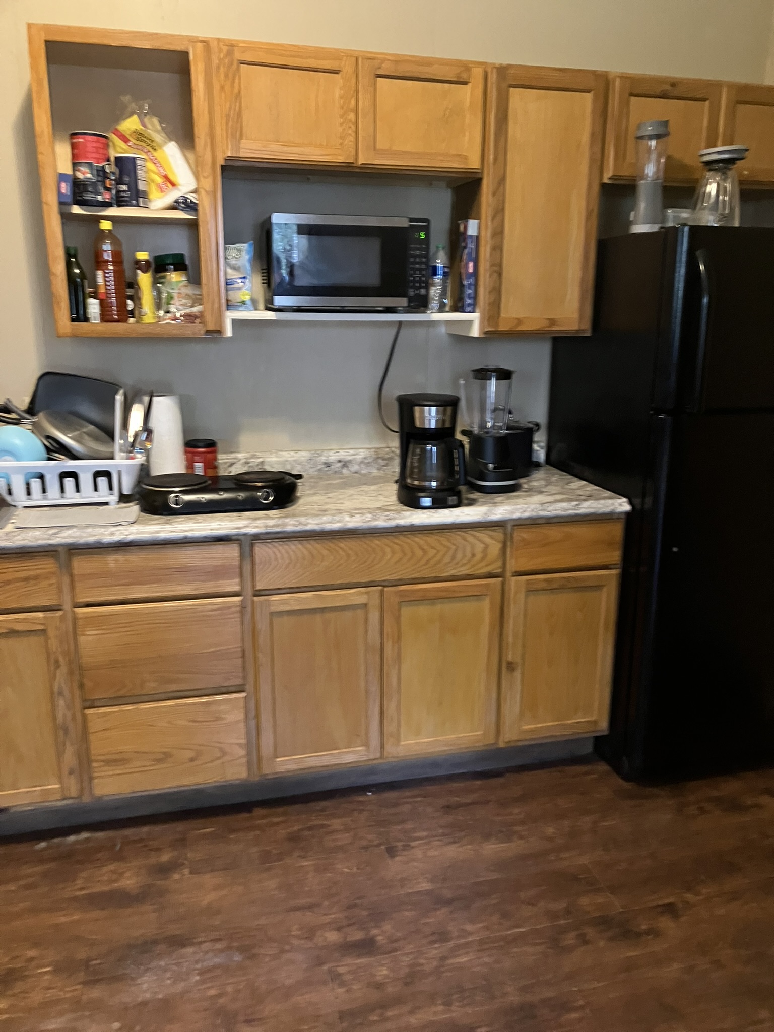 photo of a kitchen cabinets and microwave